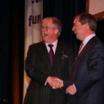 March 2012 Nigel Farage welcomes Roger to UKIP on the stage at Skegness