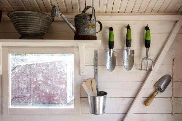 Gardening tools in a small storage shed